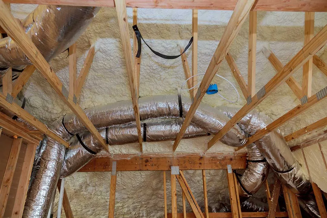 Attic insulation with a fiberglass cold barrier